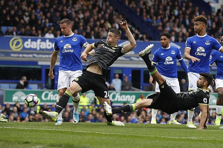 Chelsea defender Gary Cahill scoring his team's second goal against Everton on Sunday. The Blues won the Premier League match 3-0.