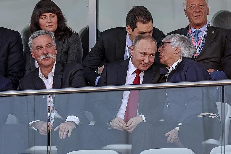 Russian President Vladimir Putin (left) and former F1 supremo Bernie Ecclestone sharing a conversation in the stands during the Russian Grand Prix at the Sochi Autodrom circuit on Sunday.