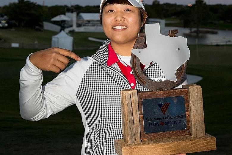 Haru Nomura of Japan with her trophy after defeating Cristie Kerr on the sixth play-off hole to clinch the Volunteers of America Texas Shootout. She had led by two strokes on Saturday, but shot a five-over 76 on Sunday to tie with Kerr on 281 at the 