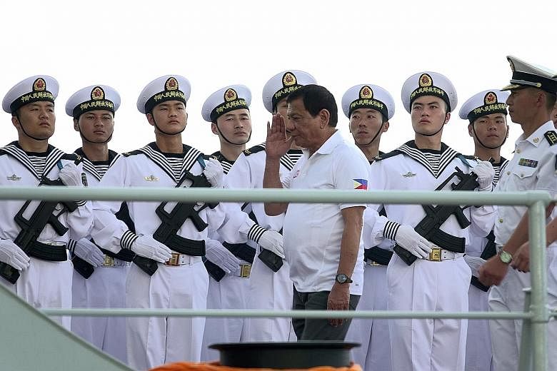 Philippine President Rodrigo Duterte on one of the three Chinese naval vessels in Davao City yesterday. The visit "is part of confidence-building and goodwill", he said.