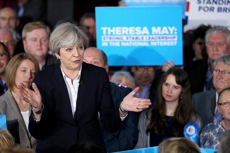 British Prime Minister Theresa May speaking to party members in Mawdsley, Britain, on Monday.