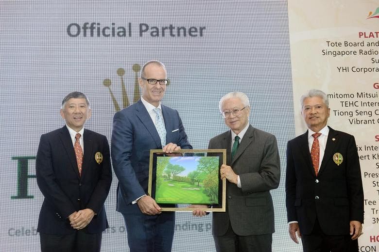 President Tony Tan (second from right) presenting a memento to Rolex Singapore CEO Chris Gisi as SICC Chairman Khoo Boon Hui (extreme left) and SICC May Day Charity Organising Chairman Andrew Lim look on.