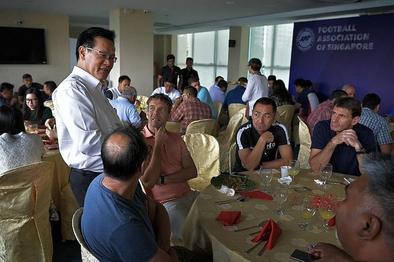 FAS president Lim Kia Tong chatting with staff over lunch at the association's headquarters at Jalan Besar Stadium.