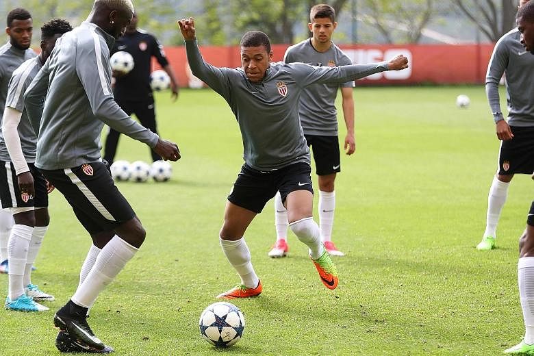 Monaco striker Kylian Mbappe (centre) taking part in a training session. The teenager will try to breach a Juventus defence that has conceded just two goals in the Champions League this season.
