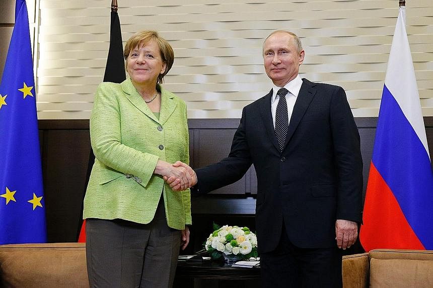 Dr Angela Merkel meeting Mr Vladimir Putin in Sochi yesterday. She said a ceasefire is required as part of the Minsk process for peace in eastern Ukraine and appealed to the Russian leader to make it happen.