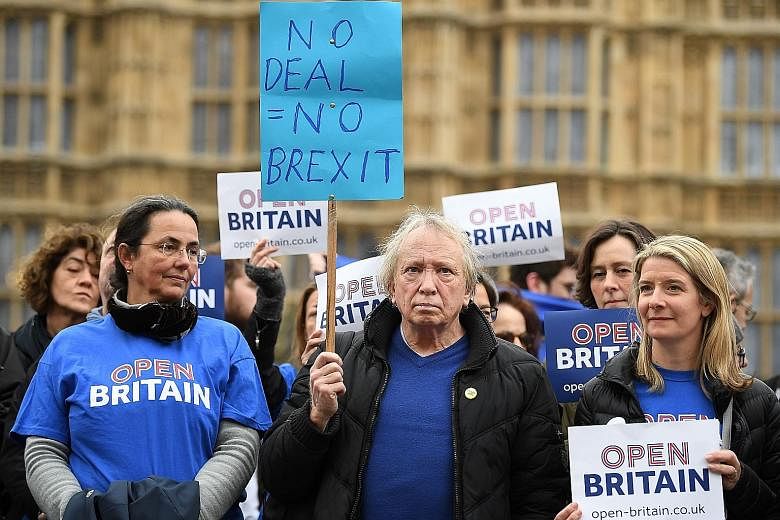 Members of the pro-EU group Open Britain protesting outside the Houses of Parliament. The Brexit negotiations are starting with the two sides miles apart, and the British government may eventually conclude that it has no option but to play by the EU'