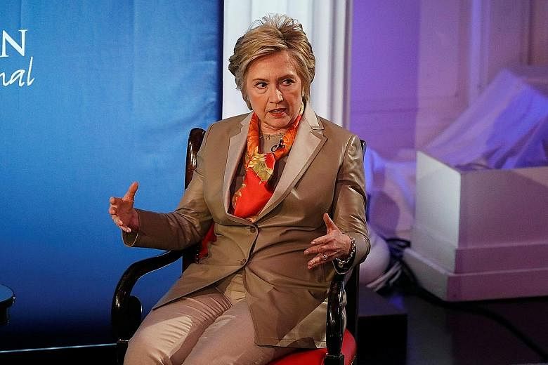 Mrs Hillary Clinton at the Women for Women International Luncheon in New York on Tuesday. She blamed her defeat in last year's White House race on Mr James Comey and Russian President Vladimir Putin, saying they had "scared off" voters.