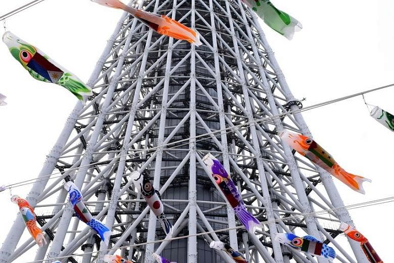 Carp-shaped windsocks outside the Tokyo Skytree in Japan's capital set the stage for tomorrow's Children's Day festivities. The annual holiday is a time for honouring children and for wishing them happiness. In Japanese culture, the carp is a symbol 