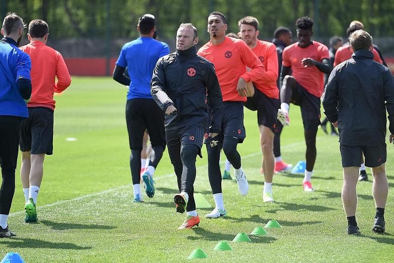 Manchester United skipper Wayne Rooney leading his team-mates, including a returning Chris Smalling, during a training session ahead of their Europa League semi-final game with Celta Vigo. Smalling's return to fitness will be much welcomed by his coa