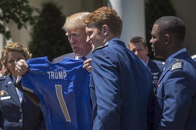 President Donald Trump getting his very own jersey from the US Air Force Academy's football team on Tuesday. He used a Rose Garden ceremony honouring the team to declare that he and Republicans had got more from the recently passed spending Bill than