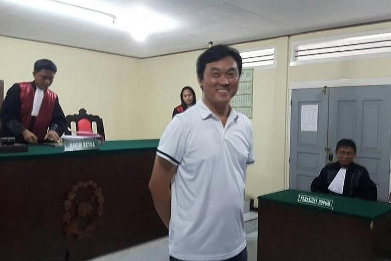 Above: Shoo Chiau Huat at a court hearing in Tanjung Pinang last October. A prosecution appeal against his acquittal for illegal fishing is still pending. Left: Mr Ricky Tan Poh Hui was released from the Tanjung Pinang Naval Base on Tuesday after he 