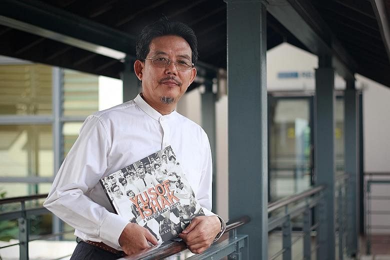 Dr Ooi Kee Beng with his book, Yusof Ishak: A Man Of Many Firsts, which chronicles Mr Ishak's life - from the son of a civil servant to head of state who would steer Singapore through its early years.