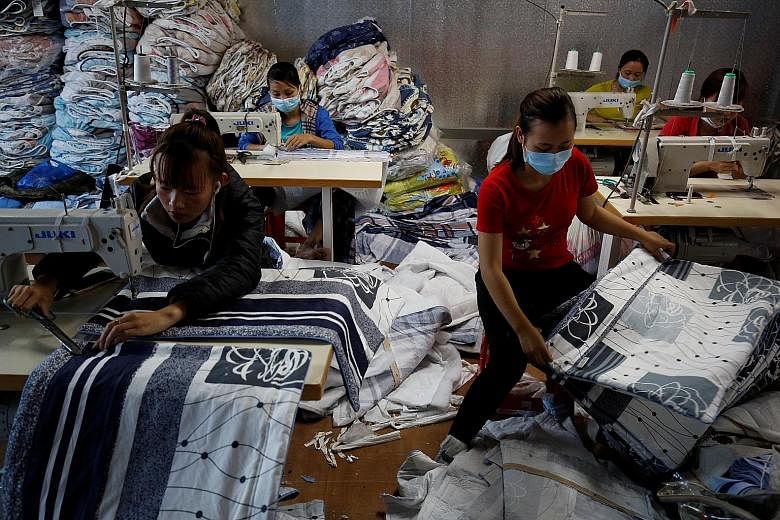 Workers at a blanket factory outside Hanoi, Vietnam, in March. Vietnam, the Philippines and Myanmar were the top performers, according to the Nikkei PMI survey.