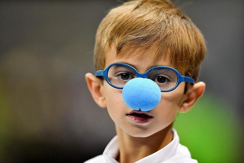 A child wearing a blue nose last Monday in support of World Autism Awareness Day. The researcher says that personal narrative helps to shape the child's development and formation of relationships.