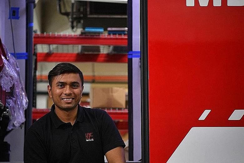 Mr Vic Naidu (above) of Hope Technik was part of the team behind the Fire Medical Vehicle (left). Its unique features will allow firefighters trained in medical services to provide early care to accident victims.