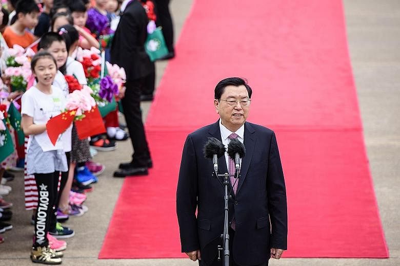 Mr Zhang Dejiang, the head of China's Parliament, received a red-carpet welcome at Macau's airport yesterday. He said the special administrative region of China has made brilliant achievements but faces an important stage as it makes a transition in 