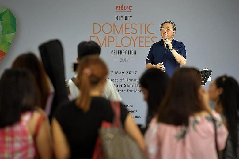 Minister of State for Manpower Sam Tan at NTUC's May Day Domestic Employees Celebration on Sunday. Yesterday, in Parliament, he said that employers should ensure their maids are properly trained and comfortable with performing a task before entrustin