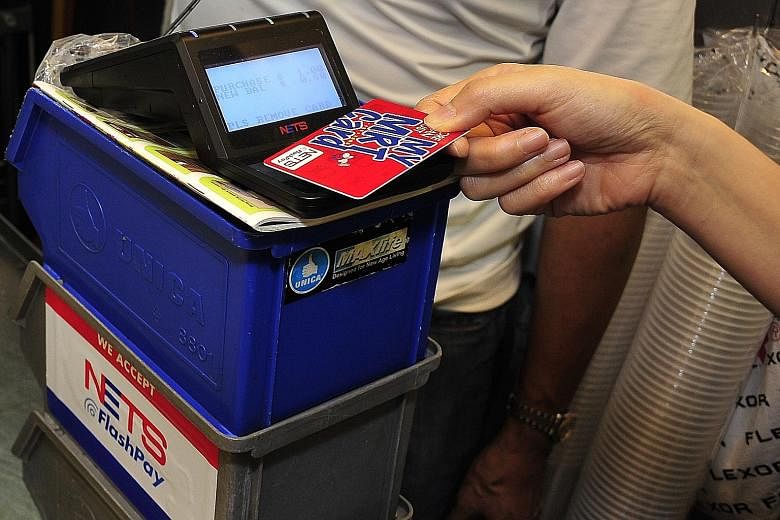 A stall offering cashless payment often has to operate several different payment devices, creating a cost burden. To offset costs, the National Environment Agency and Spring Singapore provide grants for digital service solutions.
