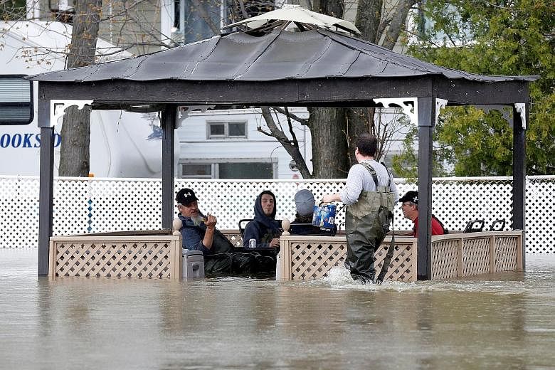 Some residents in the Canadian province of Quebec have yet to evacuate despite the authorities urging them to leave, after a combination of heavy rain and runoff from melting snow caused rivers to overflow their banks, causing widespread flooding fro