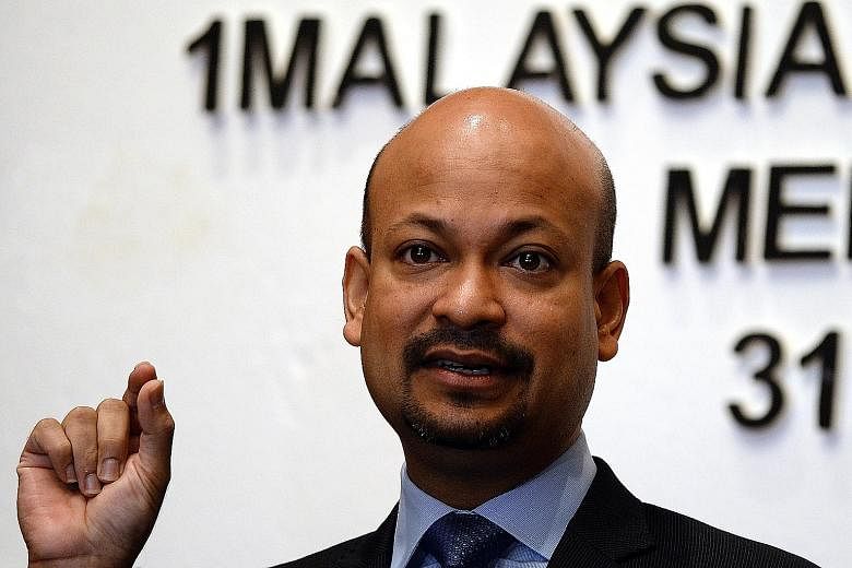 Malaysia's Second Finance Minister Johari Abdul Ghani (top) and 1MDB president Arul Kanda Kandasamy were part of a committee set up to manage the restructuring and divestment of 1MDB's assets.