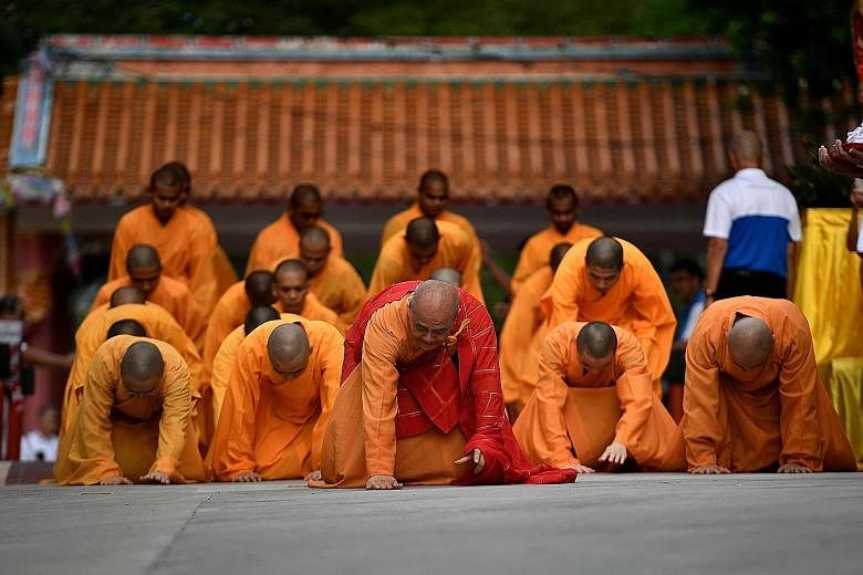 The Venerable Kwang Sheng leading monks in the "three steps, one bow" ceremony, which symbolises the long and difficult journey towards enlightenment and is meant to purify the mind of misdeeds. It started at around 5pm yesterday and ended early this