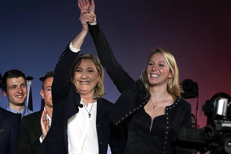 FN leader Marine Le Pen and her niece Marion Marechal-Le Pen at a political rally in 2015. The younger Ms Le Pen is giving up her seat in Parliament and withdrawing from politics indefinitely.