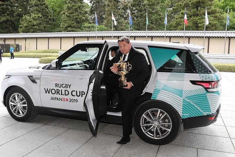 New Zealand head coach Steve Hansen arriving with the Webb Ellis Cup at the Kyoto State Guest House before yesterday's tournament draw for the 2019 Rugby World Cup, which will be hosted by Japan.