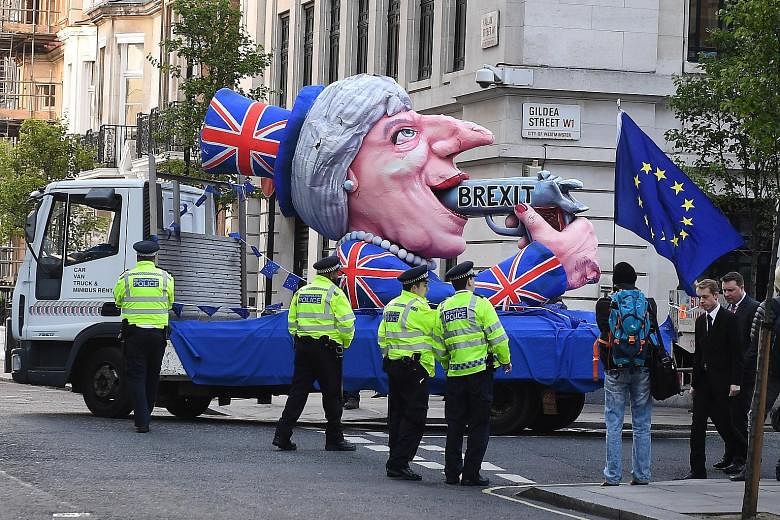Pro-EU demonstrators float their protest against Prime Minister Theresa May's visit to the BBC building for her interview. Mrs May was joined by her husband Philip on Tuesday evening for their first interview together. They talked about how they fell