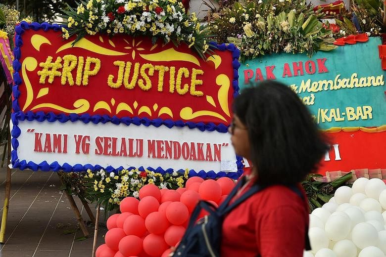Farewell wreaths for Basuki Tjahaja Purnama, who was convicted of insulting Islam and given a two-year jail term, at Jakarta's City Hall on Wednesday.