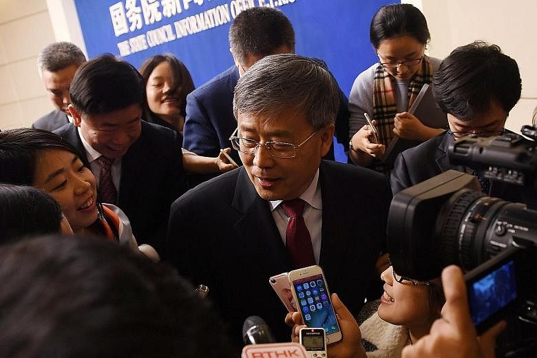 China Banking Regulatory Commission chairman Guo Shuqing speaking to journalists in March. He has vowed to clean up "chaos" in the banking system, with CBRC examining how proceeds from negotiable certificates of deposit are being used.