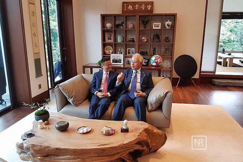 Malaysian Prime Minister Najib Razak with Alibaba executive chairman Jack Ma at the company's headquarters in Hangzhou yesterday. Datuk Seri Najib wrote on his Facebook page later that he was impressed with the achievements of the Chinese online gian