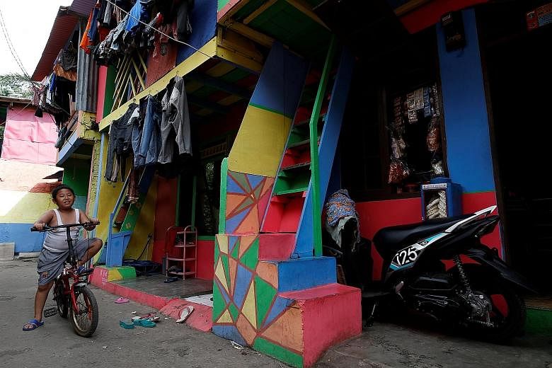 Penas Tanggul, a neighbourhood in Jakarta, has houses in bright colours to urge residents to stop smoking and promote a smoke-free environment.