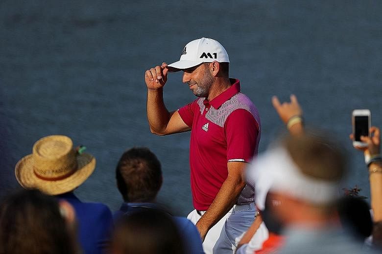 Sergio Garcia celebrates his hole-in-one during the first round of The Players Championship. The Spaniard recovered from a poor start to join Rory McIlroy and Jordan Spieth on one-over 73, but Adam Scott squandered the chance to take a first-round le