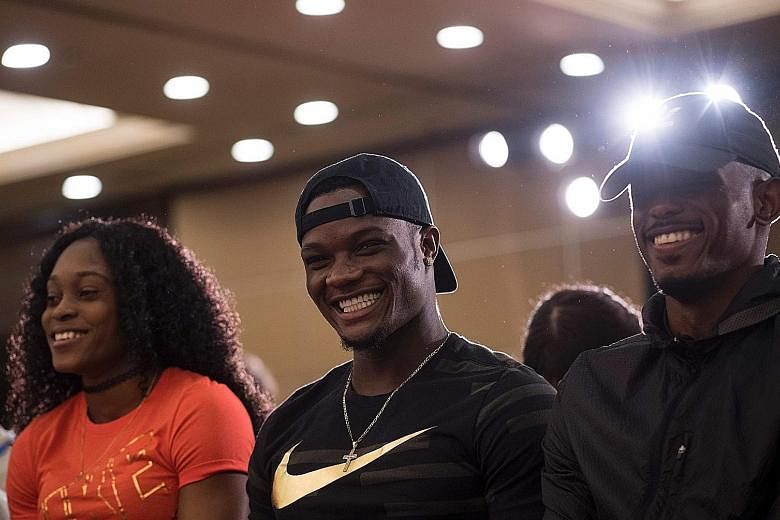 Elaine Thompson and Omar McLeod of Jamaica, who have three Olympic gold medals between them, facing the media yesterday before the Shanghai Diamond League meet.
