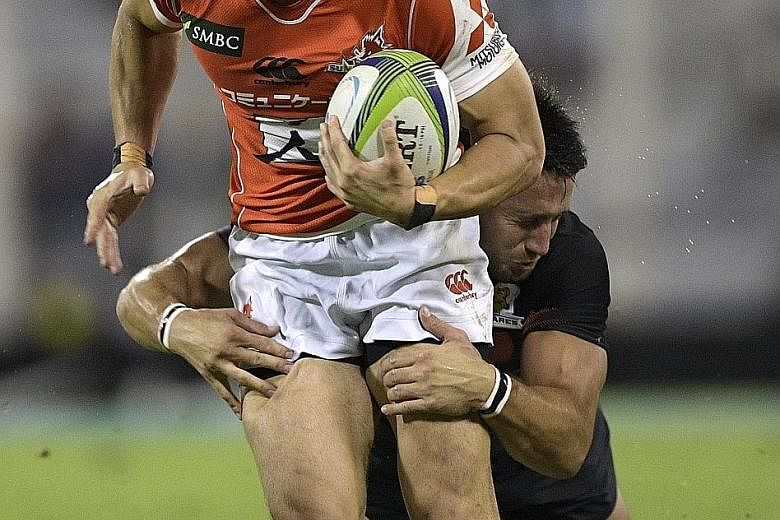 Sunwolves wing Kenki Fukuoka (front) being tackled by Jaguares centre Santiago Gonzalez Iglesias during their Super Rugby match last Sunday. The Sunwolves lost 39-46 despite scoring five tries.