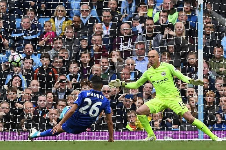 Manchester City goalkeeper Willy Caballero is beaten by a 77th-minute penalty by Leicester City's Riyad Mahrez. But the Algerian midfielder's equaliser was deemed to be a double touch and City held on to win 2-1 at the Etihad Stadium yesterday.