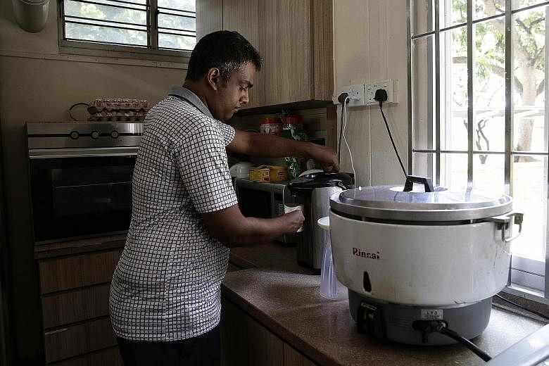 Mr Muhammad Arif Mohamed making a hot drink at Minds' Clementi Training and Development Centre, where he is taught how to take care of himself. He has also learnt how to take public transport and buy food.