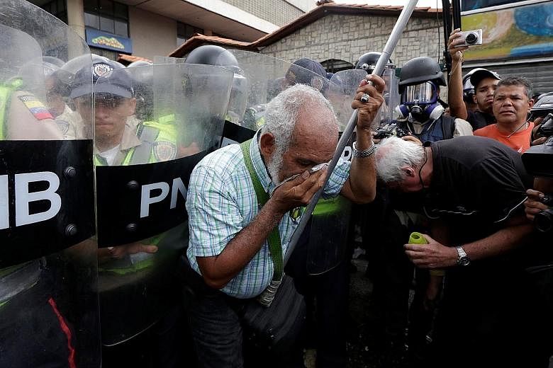 Elderly supporters of the opposition in Venezuela were pepper sprayed by riot security forces during an anti-government protest in Caracas on Friday.