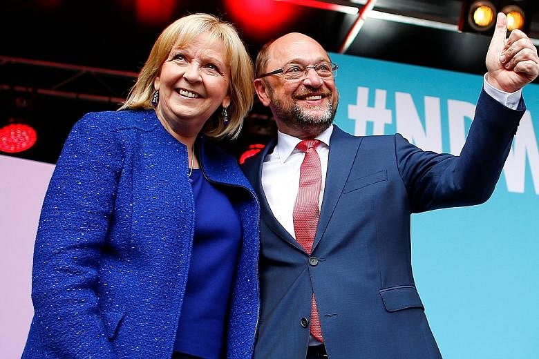 North Rhine- Westphalia premier and SPD candidate Hannelore Kraft campaigning with party leader Martin Schulz on Friday, their last rally ahead of today's election in the German state.