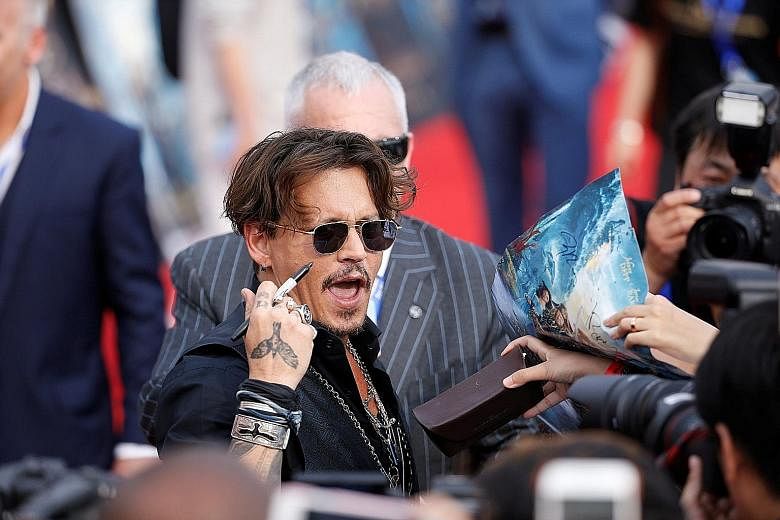 Johnny Depp attending the world premiere of Disney movie Pirates Of The Caribbean: Dead Men Tell No Tales in Shanghai last Thursday.