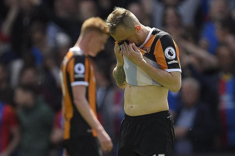 Dejection surrounds Hull City players such as winger Kamil Grosicki, as they are relegated from the Premier League on the penultimate week of the season.