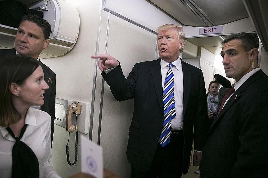 President Donald Trump speaking to reporters aboard Air Force One at Joint Base Andrews in Maryland before departing for his first overseas trip on Friday. Mr Trump's pick will have to be confirmed by the Senate. Justice Department officials have alr
