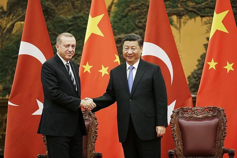 Meeting on the sidelines of the One Belt, One Road summit in Beijing, which ends today, Chinese President Xi Jinping told Turkish President Recep Tayyip Erdogan that developing strategic cooperation was in the interests of both countries. A police of