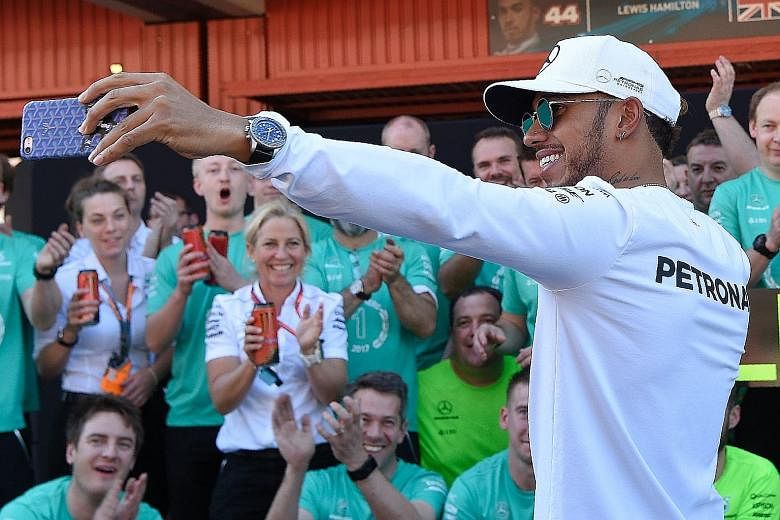 Lewis Hamilton taking a wefie with the Mercedes crew after beating Sebastian Vettel to win the Spanish Grand Prix on Sunday.