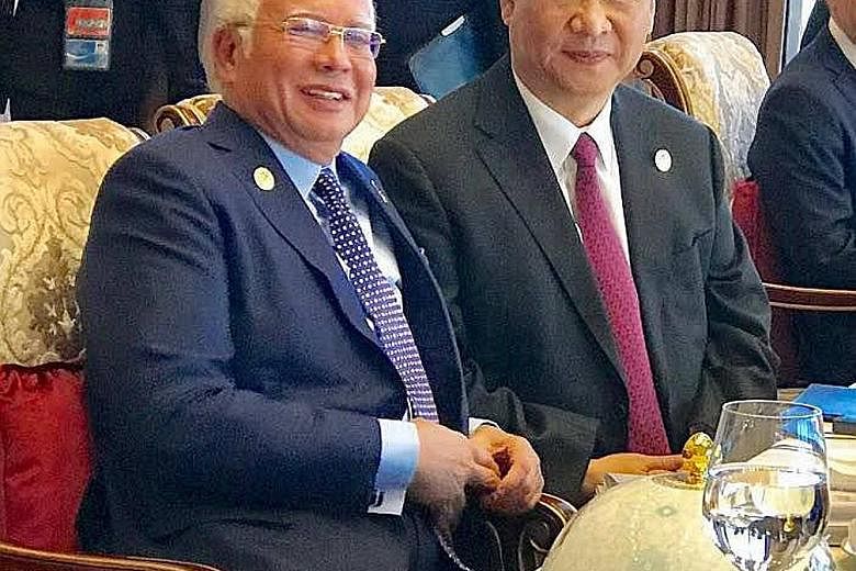 Malaysian Prime Minister Najib Razak with Chinese President Xi Jinping. Mr Najib said the property project's formula for equity stakes would be changed.
