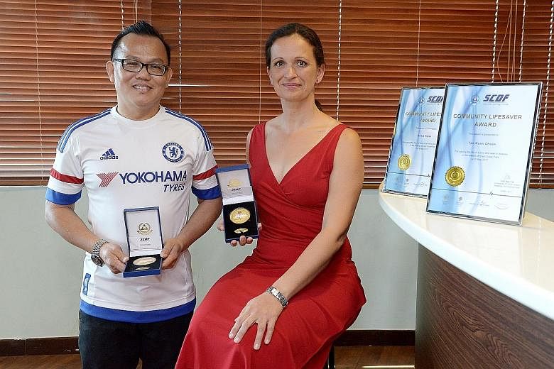 Mr Tan Kian Choon and Ms Silvia Hajas received the Community Lifesaver Award yesterday. Earlier this month at East Coast Park, Ms Hajas rescued two boys at sea while Mr Tan helped her save a third.