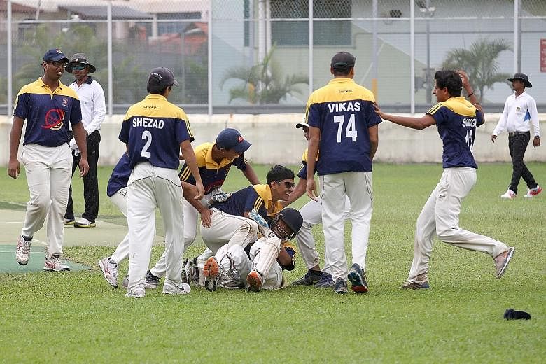 Anglo-Chinese School (Independent) celebrating after beating Raffles Institution by 29 runs in the A Division cricket final to retain their title. Although ACS(I) were defending a modest 110, they bowled out their opponents for 81 runs in 17.2 overs.