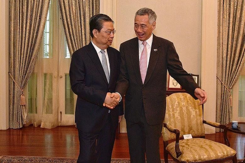 China's Central Organisation Department Minister Zhao Leji calling on Prime Minister Lee Hsien Loong at the Istana yesterday. They spoke about regional issues and affirmed close ties between China and Singapore.