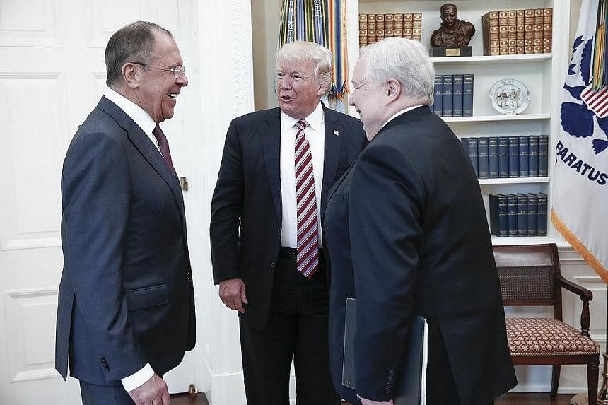 The Washington Post reported on Monday that US President Donald Trump (centre) revealed highly classified information about an ISIS terror threat linked to the use of laptops on airplanes during a meeting with Russian Foreign Minister Sergei Lavrov (