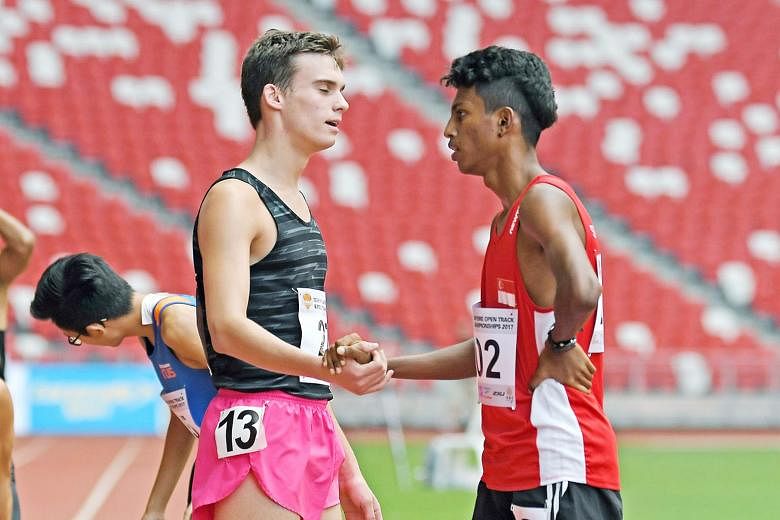 Thiruben Thana Rajan (right) is congratulated by a rival after completing the 400m at the Singapore Open last month. 